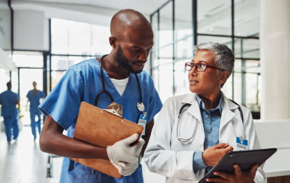 medical staff holding folder and talking