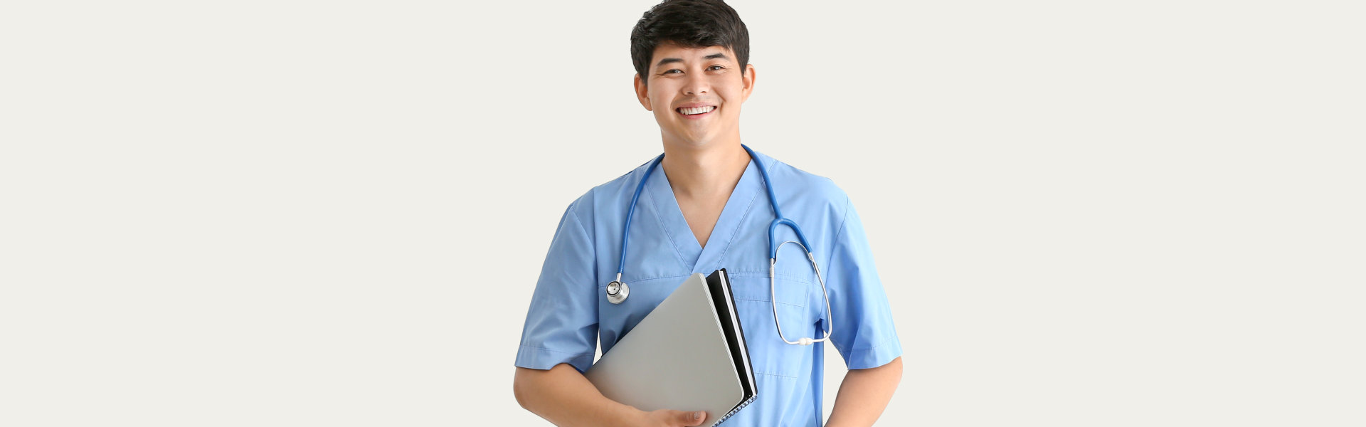 nurse with stethoscope and folder looking at the camera