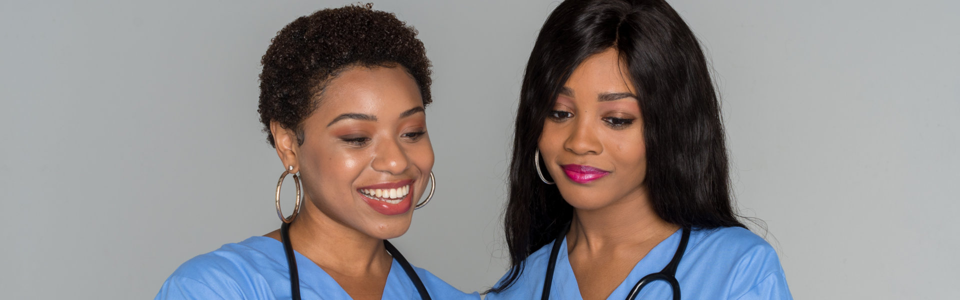 two nurse smiling