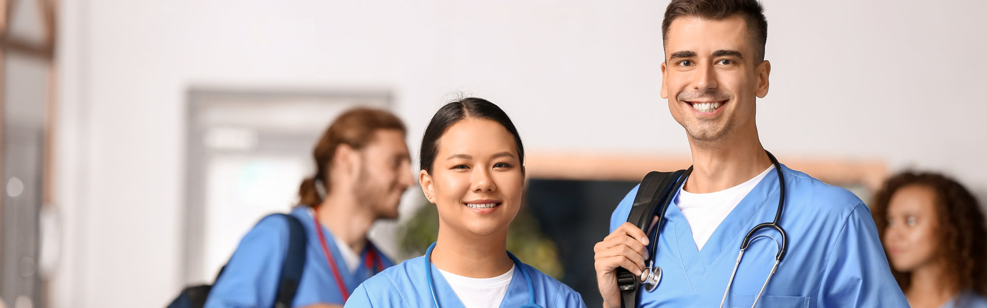 nurse smiling and looking at the camera